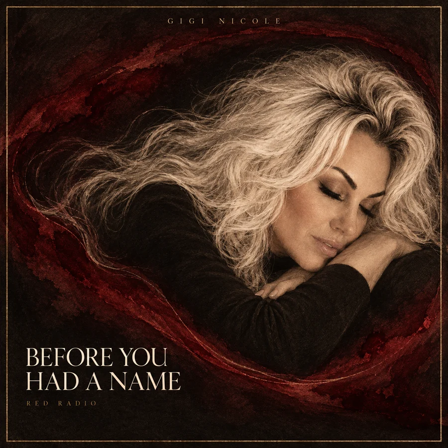 Gigi Nicole artist artwork with closed eyes and flowing platinum hair surrounded by oxblood fabric